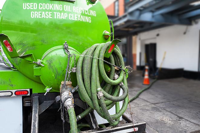 large truck pumping grease trap at a restaurant in Arcadia CA